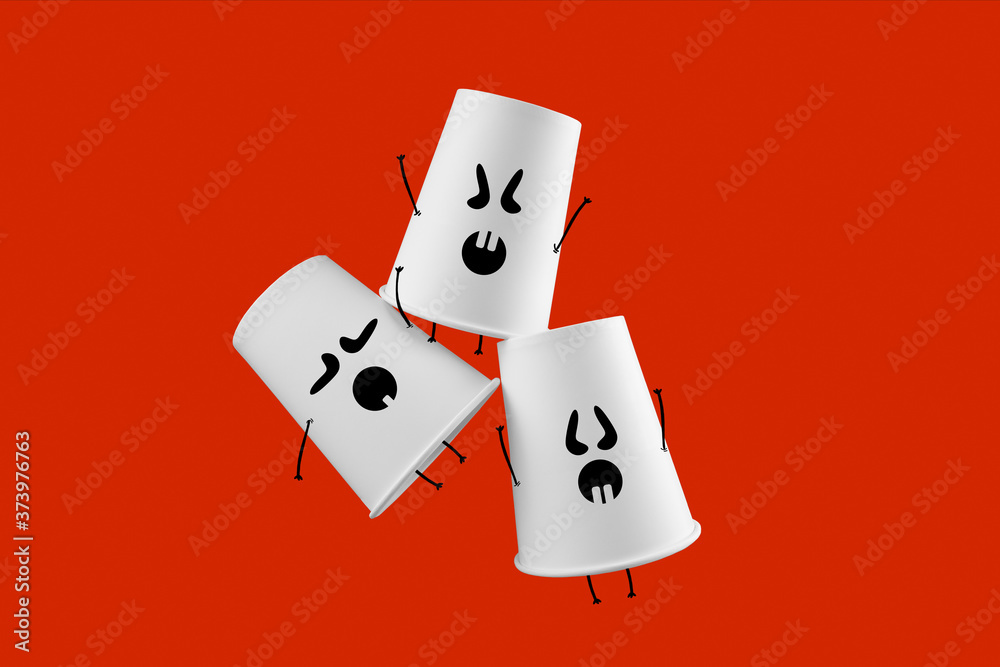 Halloween art. Flying white paper coffee cups with monster faces on red background. Space for text. Halloween art. Flying white paper coffee cups with monster faces on red background. Space for text.