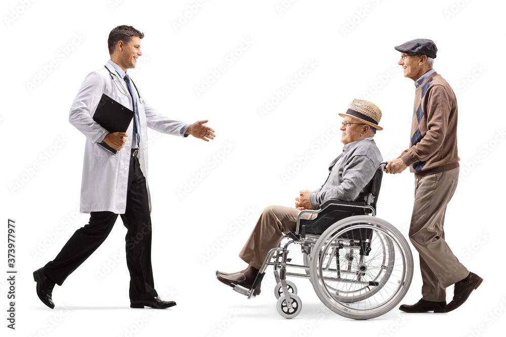 Full length profile shot of a doctor walking and greeting elderly patient in a wheelchair Full length profile shot of a doctor walking and greeting elderly patient in a wheelchair