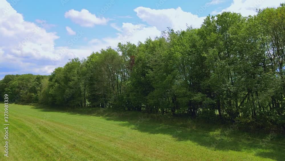 Low Altitude flight Panning around a Farm Field in the Pennsylvania Mountains Countryside in 4K 59.94p ProRes Low Altitude flight Panning around a Farm Field in the Pennsylvania Mountains Countryside in 4K 59.94p ProRes