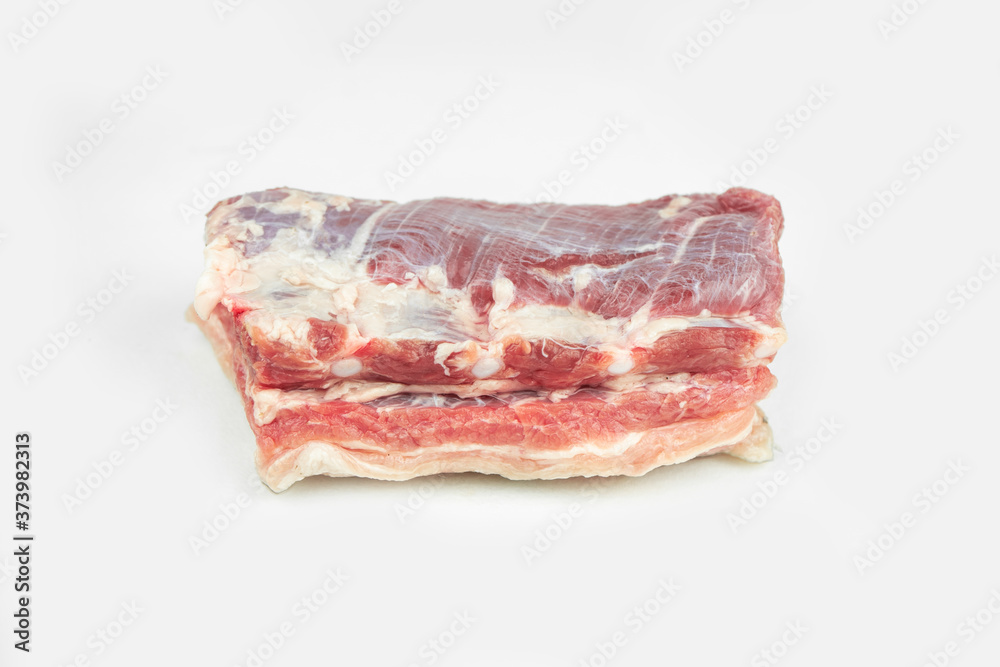 piece of fat pork ribs, raw meat, isolated on white