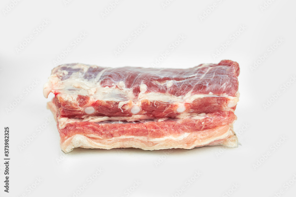 piece of fat pork ribs, raw meat, isolated on white