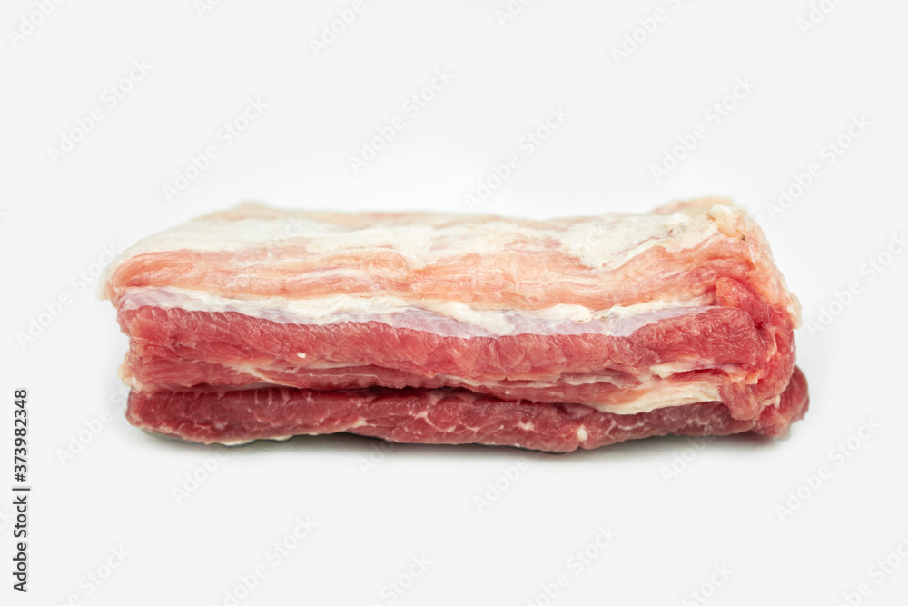 piece of fat pork ribs, raw meat, isolated on white piece of fat pork ribs, raw meat, isolated on white