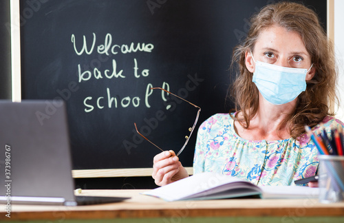 teacher wearing face mask back to school during covid pandemics
