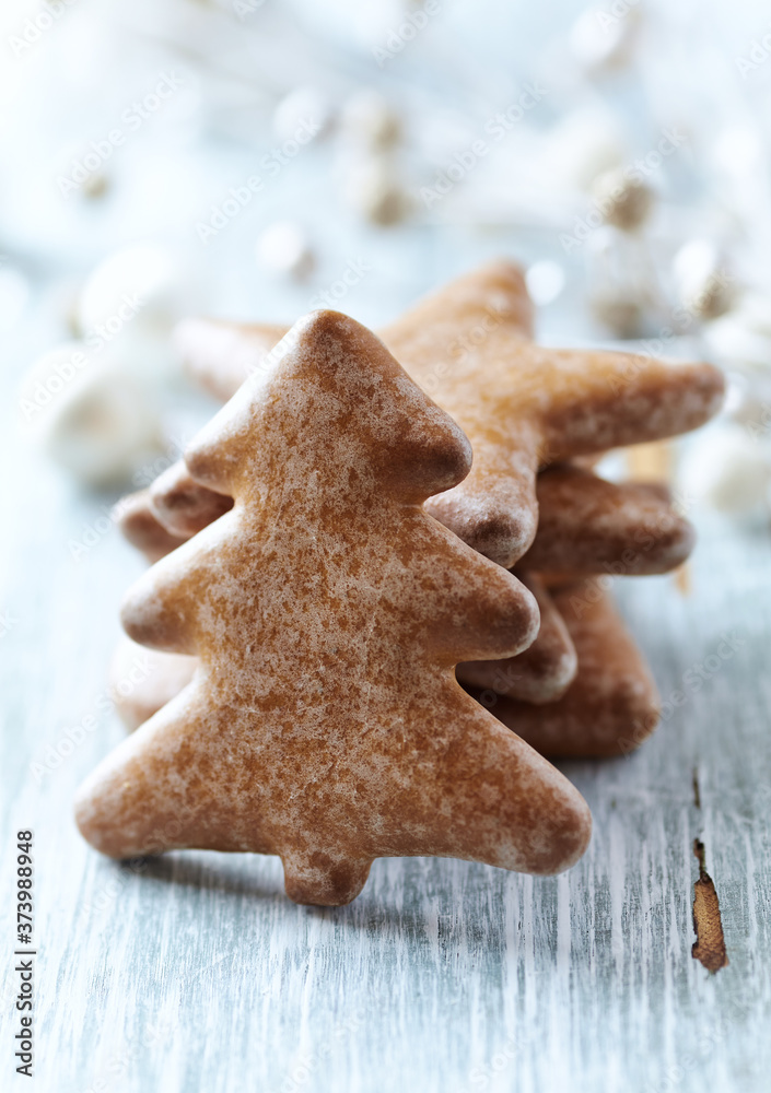 Christmas gingerbread cookies on wooden background. Close up. Christmas gingerbread cookies on wooden background. Close up.
