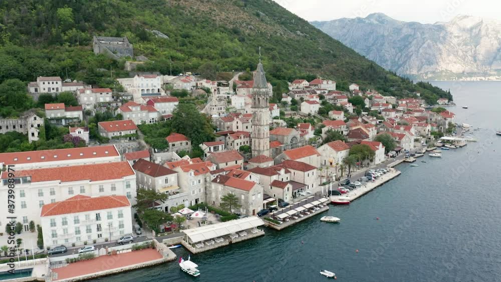 Perast Montenegro - old medieval town with its church tower, on the coast of Boka Kotor Bay. Perast Montenegro - old medieval town with its church tower, on the coast of Boka Kotor Bay.