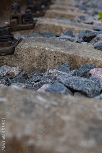 Railway rails and rubble stones.