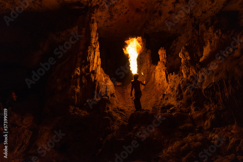 Fire show., dancing with flame. Fakir in the beautiful cave. 