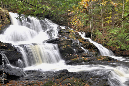 Fototapeta Naklejka Na Ścianę i Meble -  New Hampshire waterfall. Impressive and scenic Garwin Falls near Wilton, New Hampshire.  The 40 foot waterfall is also called Barnes Falls or Old Wilton Falls.