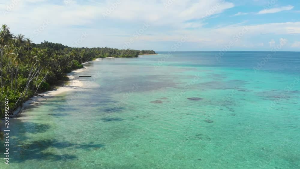Aerial: flying over exotic white sand beach tropical island secluded destination away from it all, coral reef caribbean sea turquoise water. Indonesia Sumatra Banyak islands Aerial: flying over exotic white sand beach tropical island secluded destination away from it all, coral reef caribbean sea turquoise water. Indonesia Sumatra Banyak islands
