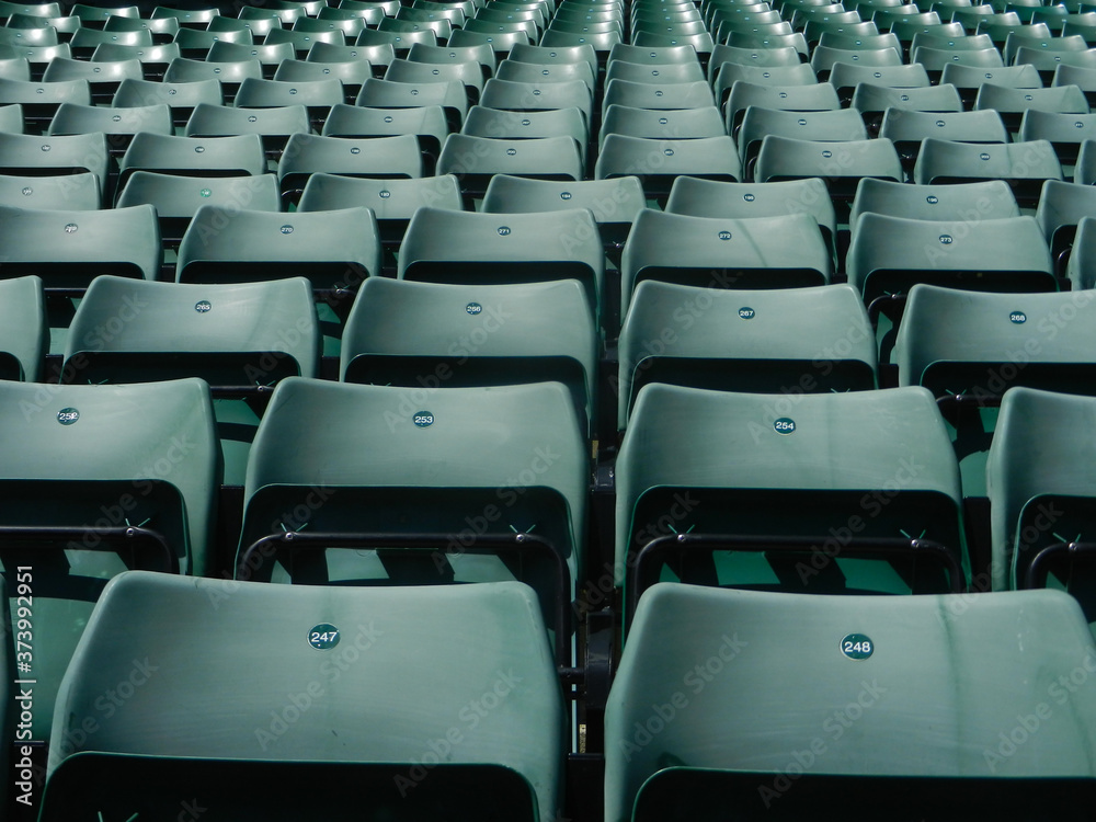Fototapeta premium Empty seats at tennis court in times of lockdown