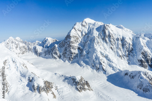 aerial view of snow covered mountains in alaska