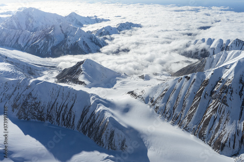 aerial view of snow covered mountains in alaska photo