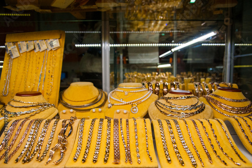 Golden accessories in a jewelery store