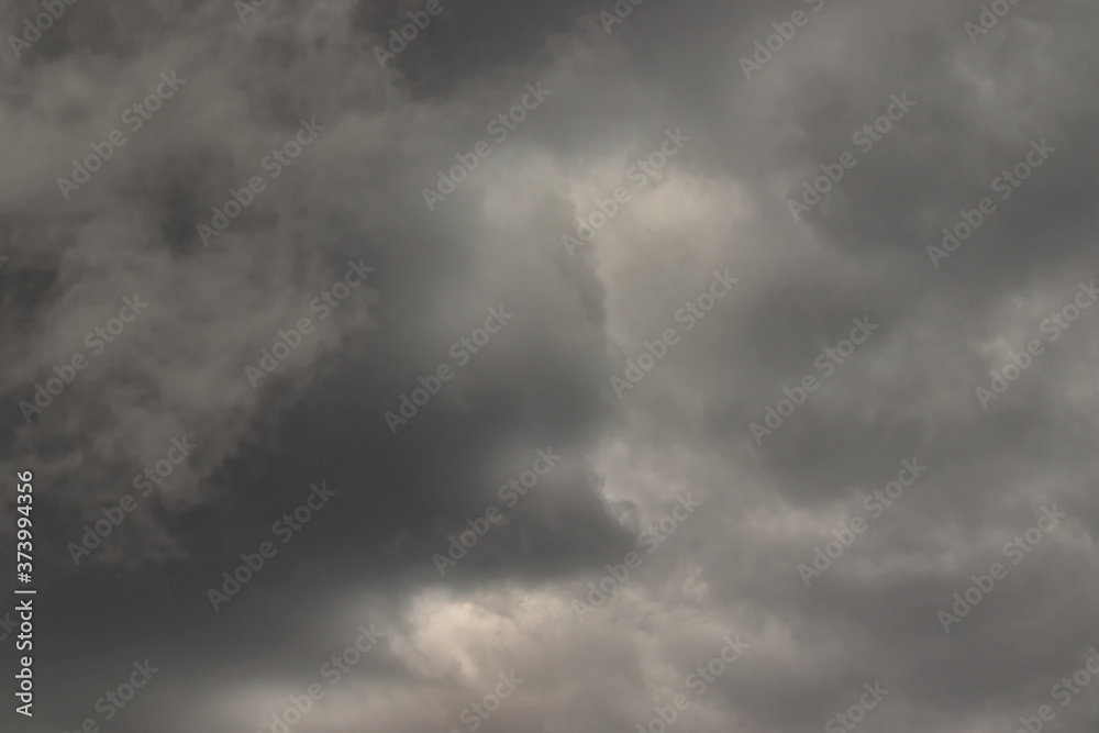 stormy clouds in various shades of gray, completely covering the sky. stormy clouds in various shades of gray, completely covering the sky.