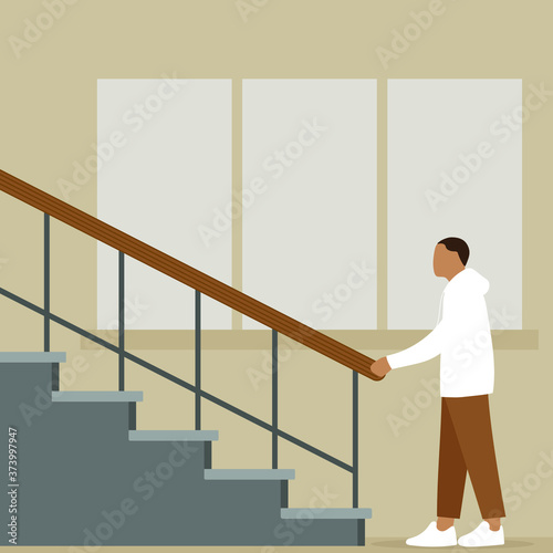 A male character stands near the stairs and holds on to the railing