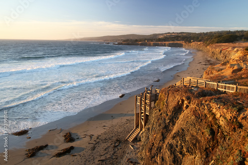 Pacific Sunset Warmth - The beach sunset invites visitors down access stairs. Black Point Beach, Sonoma Coast, California, USA