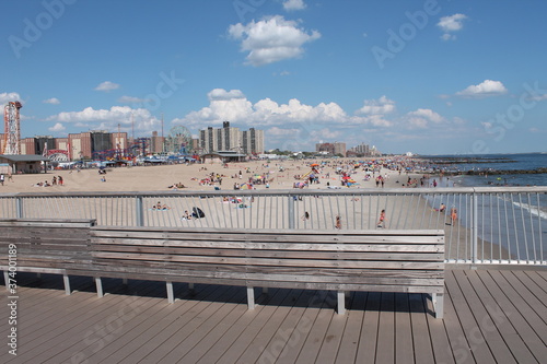 A pier with a view for the amusement park and the beach