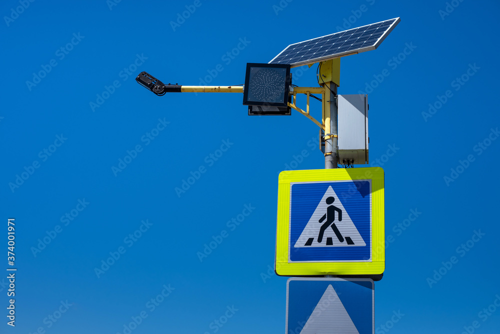 Pedestrian crossing sign with autonomous solar power. Pedestrian crossing sign with autonomous solar power.
