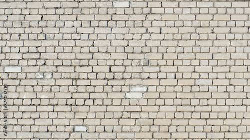 The wall is made of white sand-lime bricks.