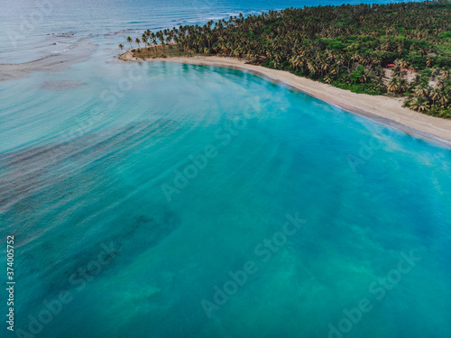 Bilde på lerret Aerial drone view of paradise beach with palm trees and blue water at the Esmera