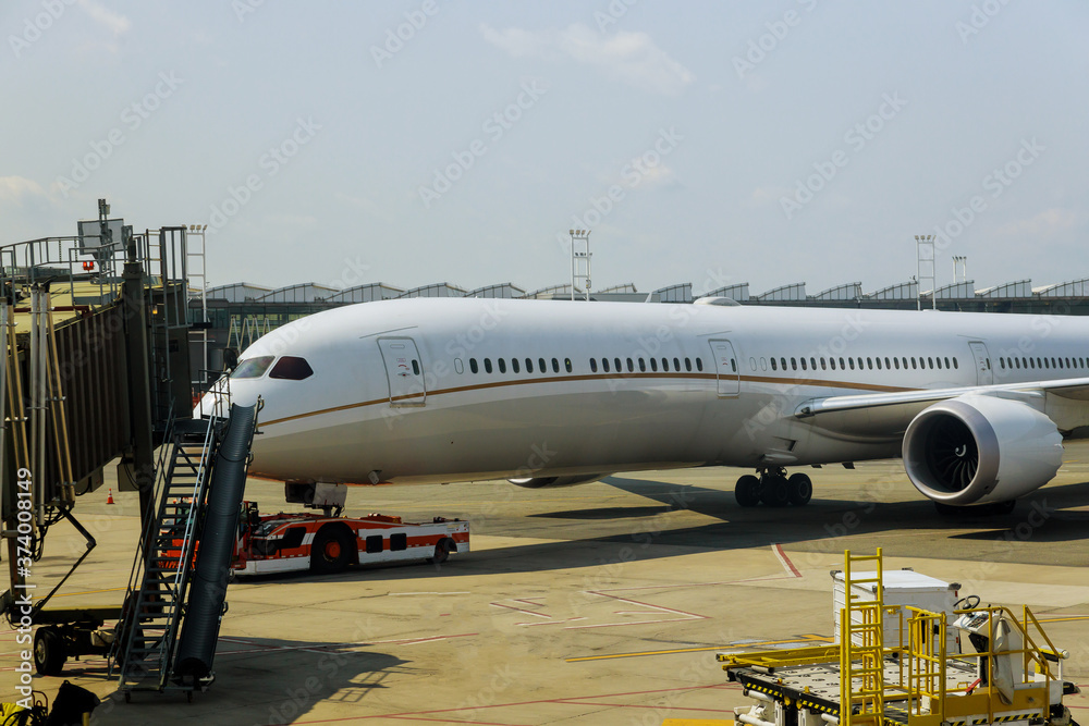 Airplane being preparing ready for takeoff in international airport at travel around the world front view of landed airplane Airplane being preparing ready for takeoff in international airport at travel around the world front view of landed airplane
