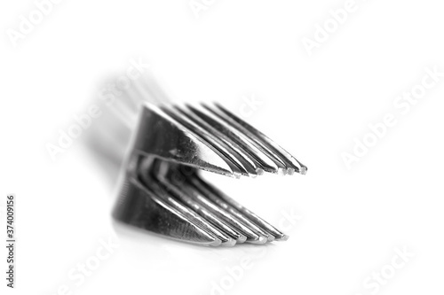Stack small fruit eating forks on white background photo