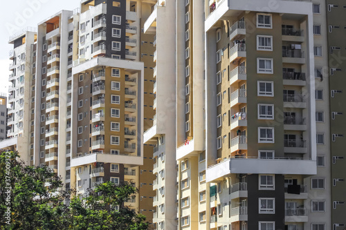 Картината върху платно Bangalore, Karnataka, India - December,12, 2015: A high rise modern apartment complex in suburban Bangalore against a blue sky on a sunny day