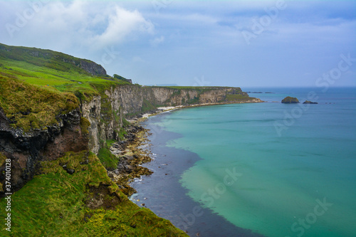 A beautiful far-reaching view of the coastline in Ireland with blue water