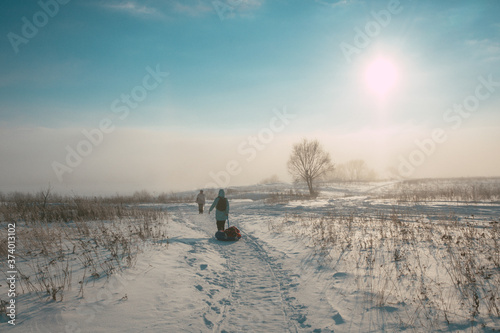 woman walking in winter © Evgenii Ryzhenkov
