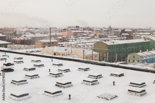 Rooftop of industrial building covered with snow in Saint Petersburg