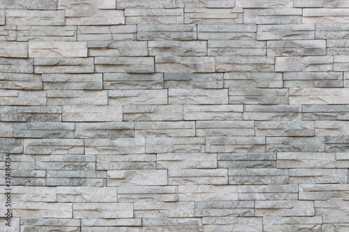 Gray slate wall stone background or texture.