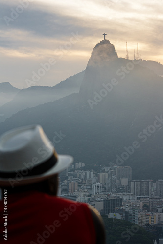 A man with white hat looking to the Corcovado in Rio de Janeir