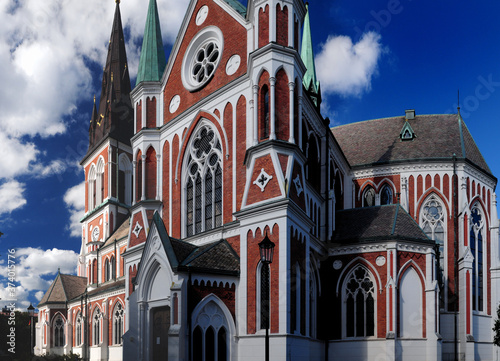 Red-White Coloured Sofia Cathedral In Jonkoping On A Sunny Summer Day With Some Clouds In The Sky photo