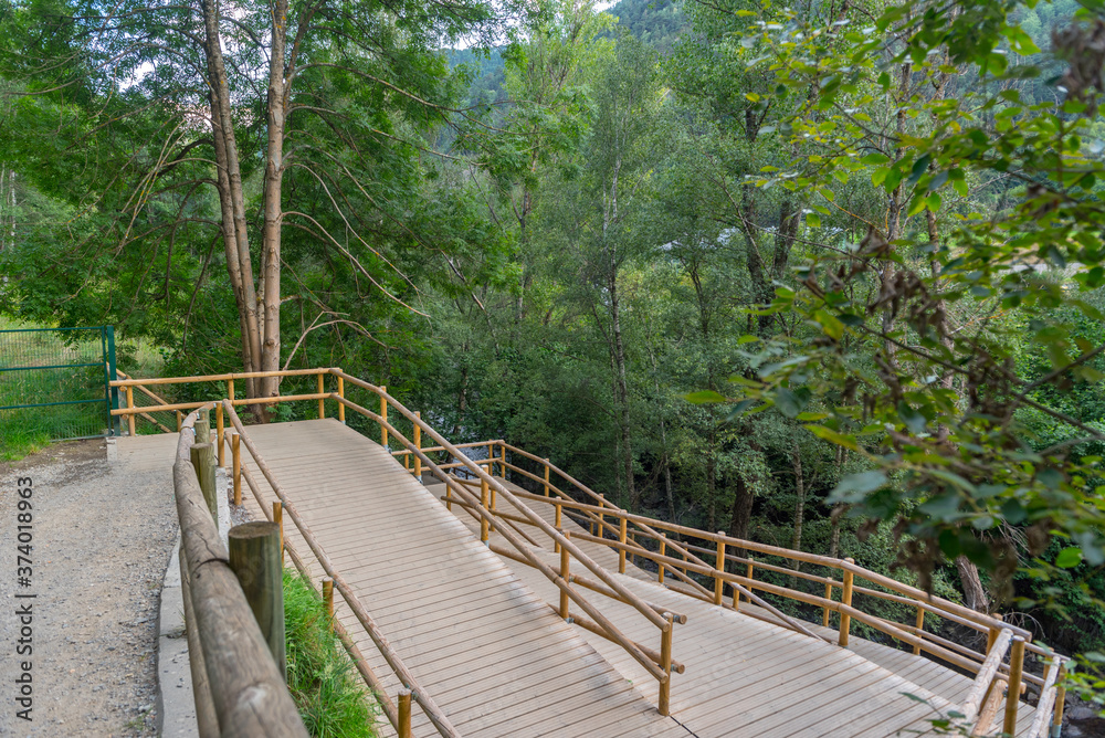 Fototapeta premium Bridge the Valira del Orient river in Cami Ral in summer in Andorra.