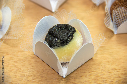 Traditional brazilian sweet on wooden background. Olho de Sogra.