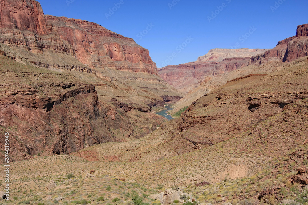 View of Colorado River and Granite Narrows in Grand Canyon National Park, Arizona from backcountry hiking trail. View of Colorado River and Granite Narrows in Grand Canyon National Park, Arizona from backcountry hiking trail.