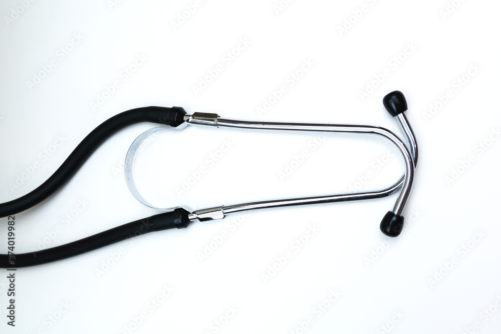 Black Stethoscope and phonendoscope isolated on white with copy space. Selective focus. Medical concept. Black Stethoscope and phonendoscope isolated on white with copy space. Selective focus. Medical concept.