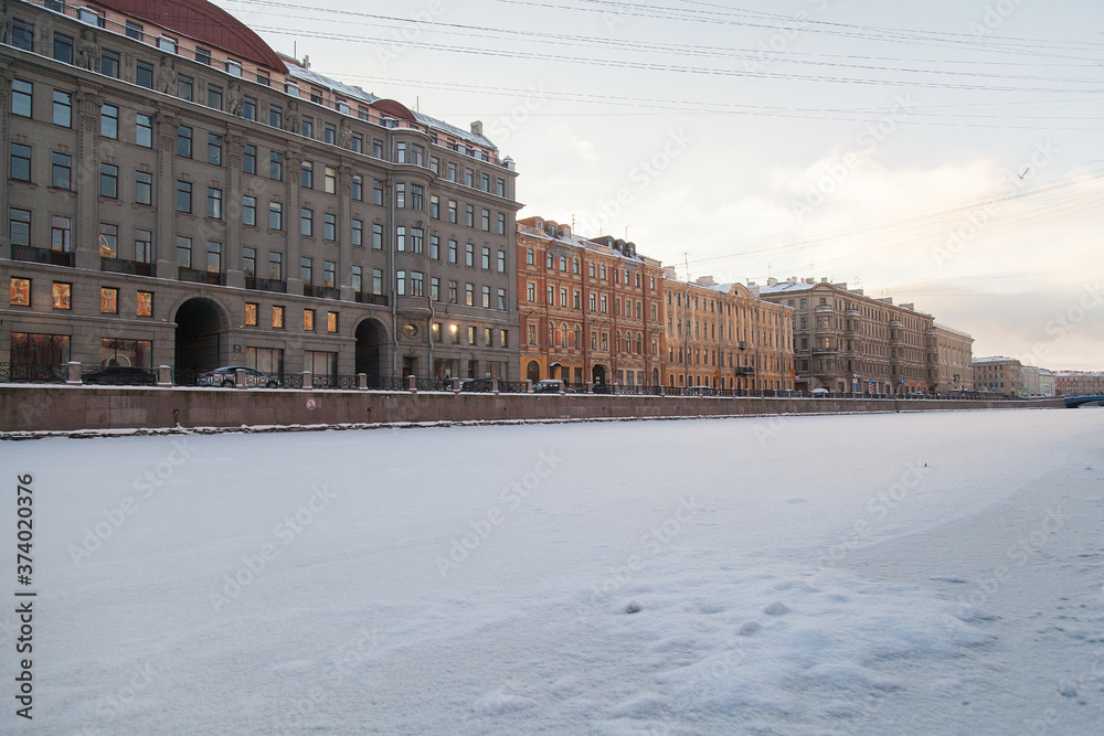Winter cityscape of St. Petersburg with the freezing Fontanka river