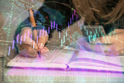 Wallpaper Mural Double exposure of businesswoman hands typing on computer and forex graph hologram drawing. Financial analysis concept. Torontodigital.ca