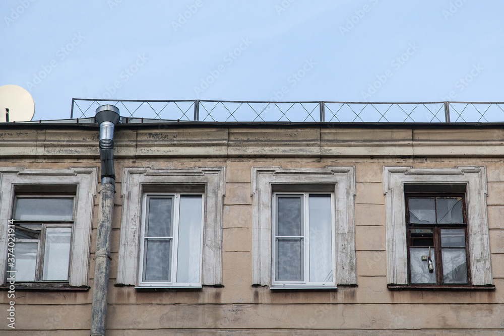 Shabby windows of old apartment buildings in St. Petersburg Shabby windows of old apartment buildings in St. Petersburg