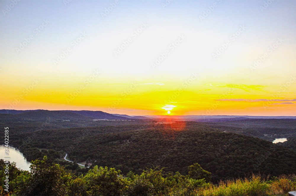 sunset over the White River and surrounding mountains in Arkansas 