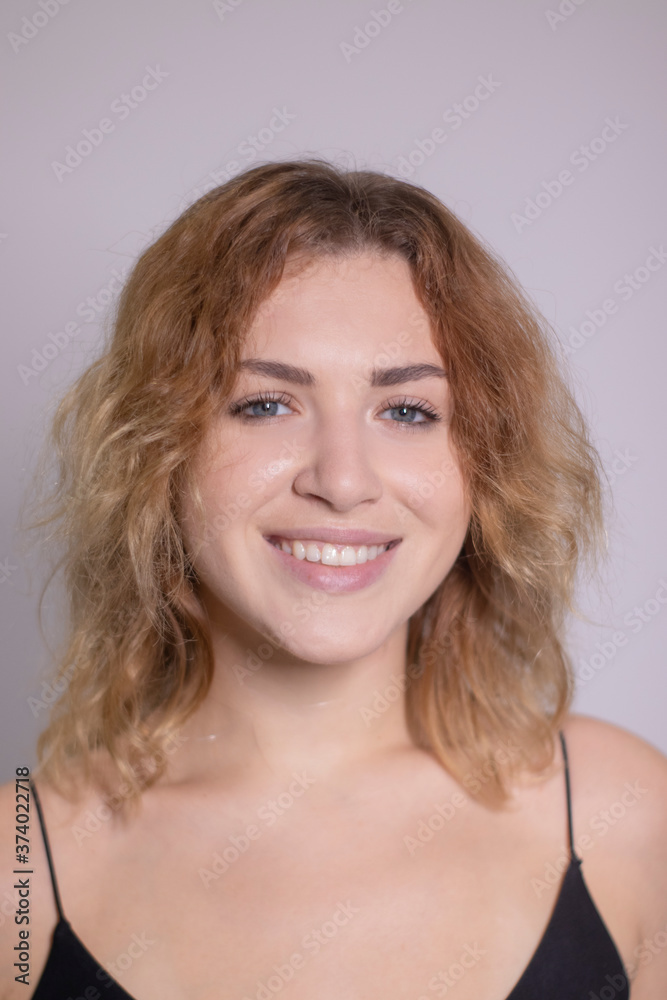 emotional portrait of a beautiful curly blonde-redhead in black undershirt. High quality photo emotional portrait of a beautiful curly blonde-redhead in black undershirt. High quality photo