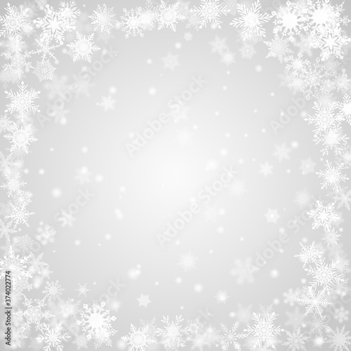 Christmas background of snowflakes arranged in a circle, in gray colors © Olga Moonlight