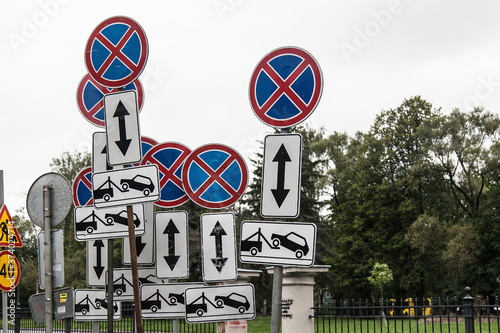 many signs prohibiting parking in one place