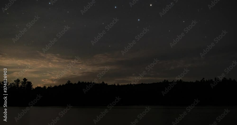 Algonquin Provincial Park Ontario Canada. Neowise Comet time lapse over Sproule Lake. Includes 3 versions - 1 stationary centered, 1 pan right, 1 stationary cropped in to 100%.