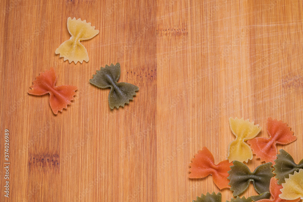 fresh pasta flower shaped on wood background