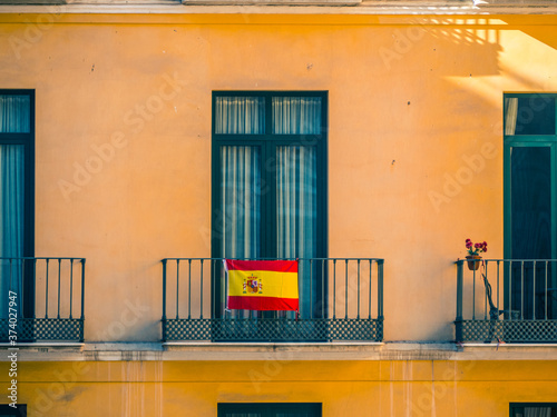 Close view of Facade with windows and spanish flags