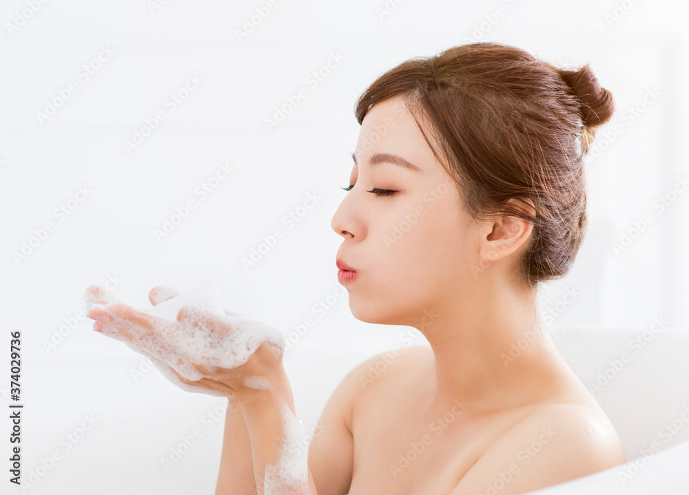 young woman take a bath in bathtub young woman take a bath in bathtub