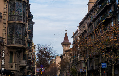 Buildings in streets of Barcelona with a tower in background