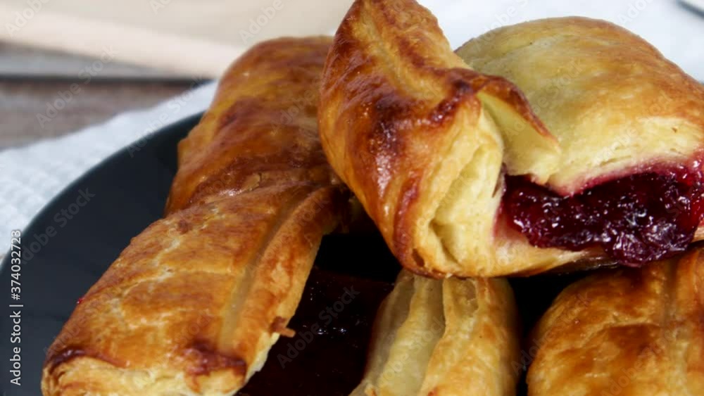 Close up of served sweet breakfast on the table. Delicious croissants and pastry with cherries Close up of served sweet breakfast on the table. Delicious croissants and pastry with cherries